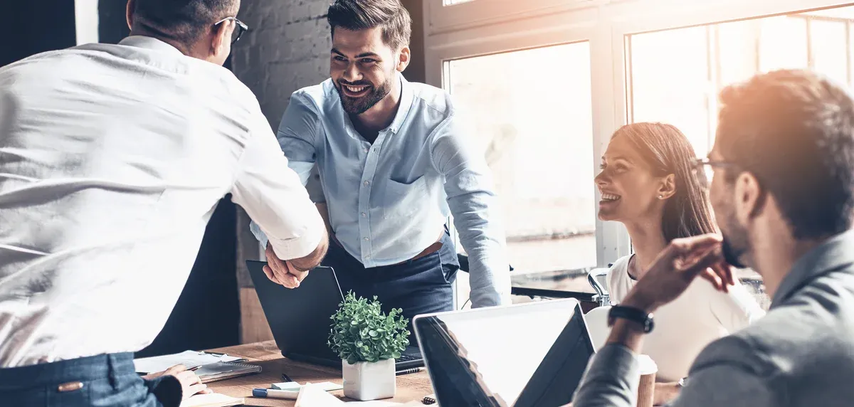 Shaking hands in a business meeting
